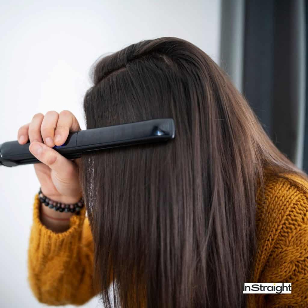lady showing how to rebond hair at home